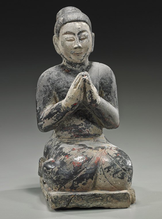 Antique Burmese Lacquered Stone Figure: Antique Burmese Lacquered Stone Figure Antique Burmese carved and lacquered stone figure; kneeling, wearing long robes and with hands in praying position (typical wear, degradation and chip to base); 