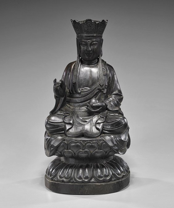 Chinese Carved Hardwood Buddhist Figure: Chinese Carved Hardwood Buddhist Figure Heavy Chinese carved hardwood, possibly zitan, Buddhist figure; seated in lotus posture atop a stylized lotus pedestal base, wearing long robes and a Buddha cro