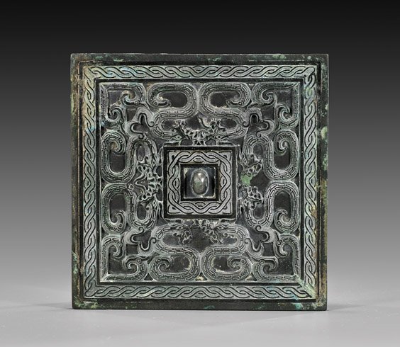 WARRING STATES PERIOD BRONZE MIRROR: WARRING STATES PERIOD BRONZE MIRROR Chinese Warring States Period, archaic bronze mirror; of extremely rare square form: with beautifully detailed, symmetrical design of scrolling hydras, in between t