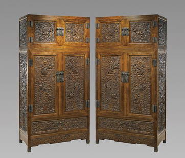 PAIR CHINESE HARDWOOD CABINETS: PAIR CHINESE HARDWOOD CABINETSPair of fine and massive Chinese hardwood stacking cabinets: of rectangular forms, the doors and sides with very finely carved with design of densely intertwined dragons