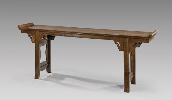 CHINESE HARDWOOD ALTAR TABLE: CHINESE HARDWOOD ALTAR TABLE Fine Chinese hardwood altar table; rendered in 17th Century-style, of typical long form, with upturned sides, and simple cut-out corners supports; the finely grained wood 