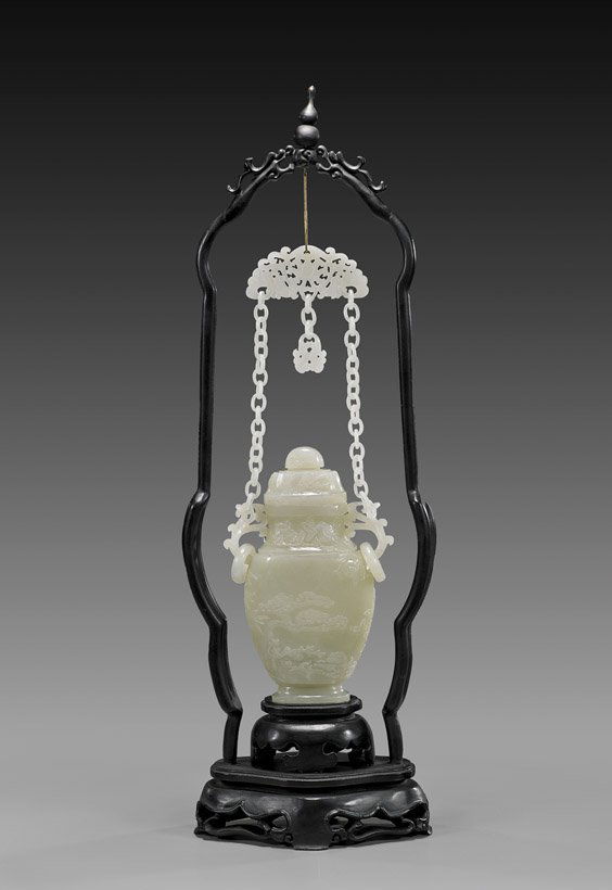 CARVED CELADON JADE URN WITH LOOSE CHAINS: CARVED CELADON JADE URN WITH CHAINSFine Chinese carved whitish celadon jade urn and cover; of flattened baluster form, the front with design of the Three Friends of Winter (bamboo, pine and plum bloss