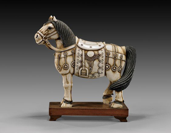 CHINESE CARVED IVORY TANG-STYLE HORSE: CHINESE CARVED IVORY TANG-STYLE HORSELarge early 20th Century, Chinese carved sectional ivory model; of a Tang-style horse: standing four-square, wearing a cloud and pearl decorated saddle, and adorne