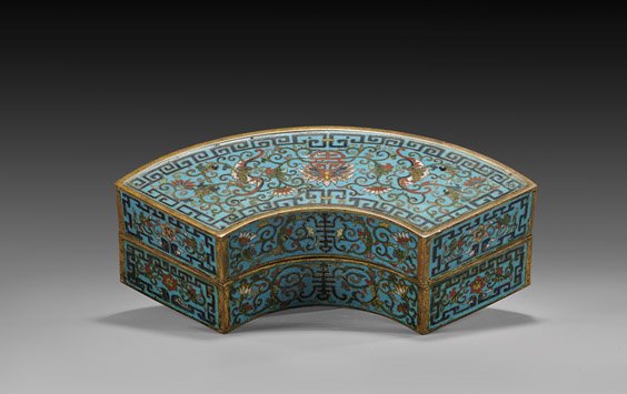 QIANLONG-STYLE CLOISONNÉ BOX & COVER: QIANLONG-STYLE CLOISONNÉ ENAMEL BOX Elaborately detailed, Chinese Qianlong-style cloisonné enamel box and cover; of demi-lune/fan form: of Buddhist motif with scrolling lotus blossoms and Shou medal