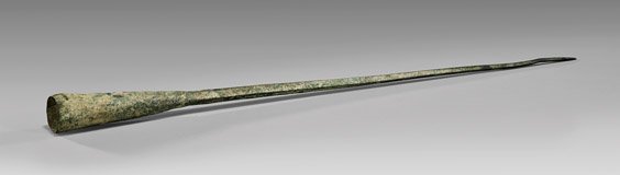 ANCIENT LURISTAN BRONZE SPEAR HEAD: ANCIENT LURISTAN BRONZE SPEAR HEAD Ancient Luristan bronze spear head; of unusual elongated, squared taper-form ending in a point; Circa 1st Millennium B.C.; L: 16 1/4"; Provenance: the Antiques Galle