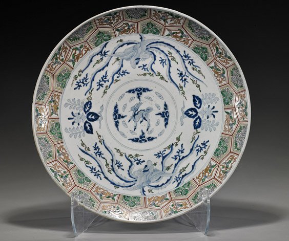 Large Antique Japanese Porcelain Charger: Large Antique Japanese Porcelain Charger Large antique Japanese Imari or Arita porcelain charger: circular form with blue and white center depicting a kirin and 2 phoenix birds, colorful floral design