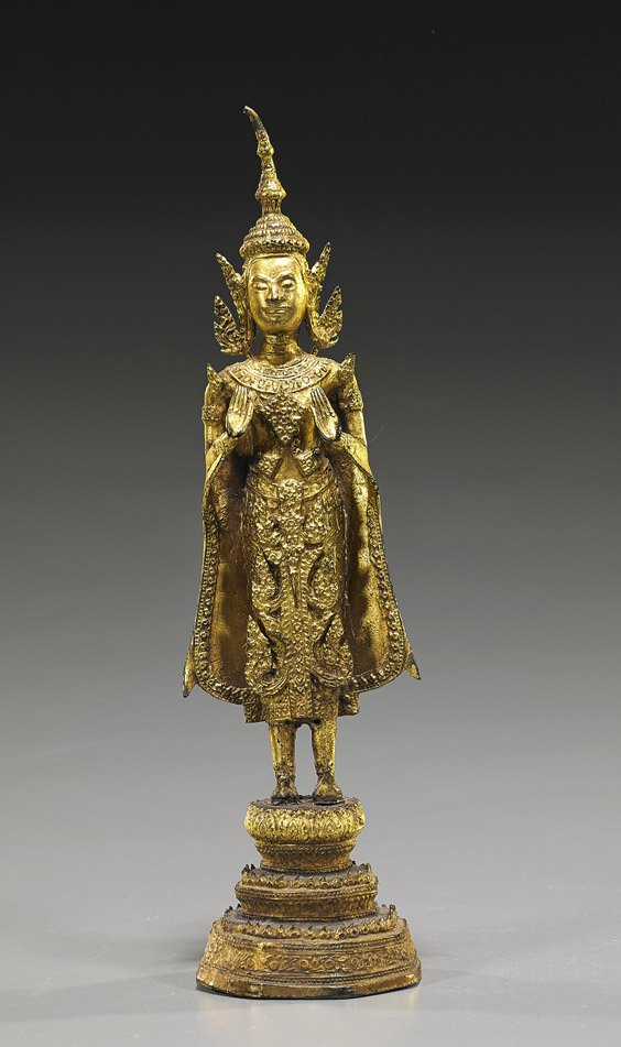 Antique Thai Gilt Bronze Buddhist Figure: Antique Thai Gilt Bronze Buddhist Figure Antique Thai gilt bronze Buddhist figure; standing atop a stepped pedestal, wearing long and elaborate robes and a tall headdress, hands in mudra (wear, finial