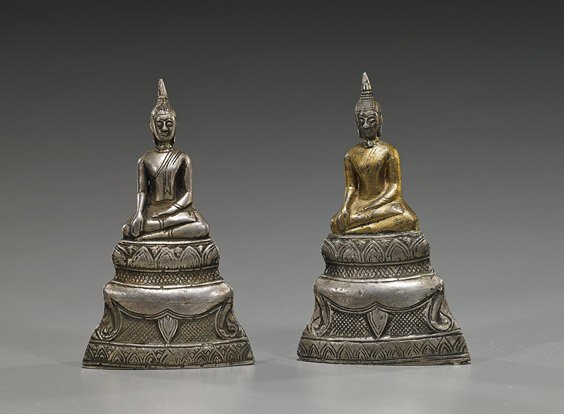 2 Antique Southeast Asian Silver Overlay Buddhas: 2 Antique Southeast Asian Silver Overlay Buddhas Two antique Southeast Asian, probably Thai, silver overlay wood Buddhas; each seated on a stepped base, with hands in mudra, and pointed ushnishas, one