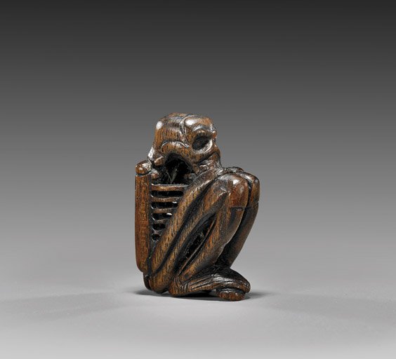 Antique Carved Wood Netsuke: Skeleton: Antique Carved Wood Netsuke: Skeleton Antique carved wood netsuke; of a highly stylized skeleton squatting and huddled into itself (usual minor wear), 19th Century