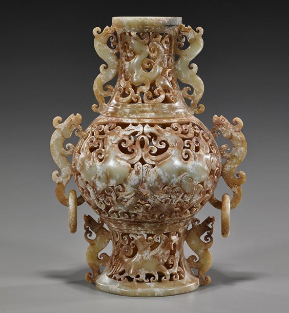 Archaistic Chinese Reticulated Hardstone Vase: Archaistic Chinese Reticulated Hardstone Vase Archaistic Chinese, fully reticulated carved hardstone vase; of baluster form with qilin and bird motifs, hydra flanges and handles with loose rings (all 