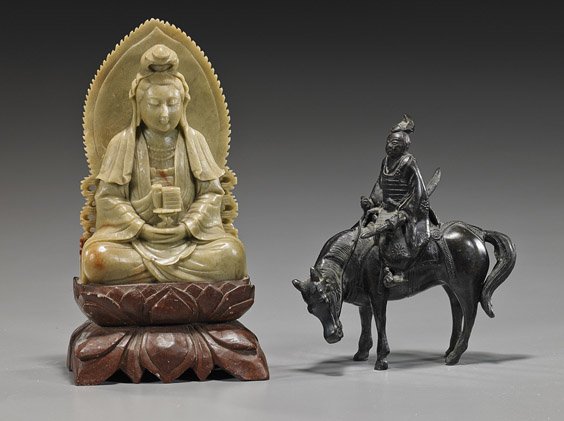 Carved Soapstone Guanyin & Bronze Samurai: Carved Soapstone Guanyin & Bronze Samurai Old Chinese carved soapstone Guanyin, seated atop a red soapstone base; together with an early 20th Century Japanese bronze small model of a Samurai, in full 