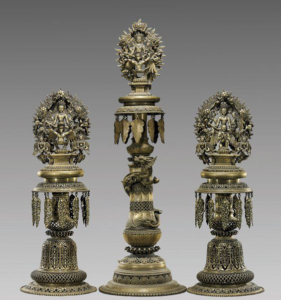 Unusual Nepalese Bronze Temple Garniture Set: Unusual Nepalese Bronze Temple Garniture SetVery unusual and probably antique very elaborately cast Nepalese 3 piece temple garniture suite; each with openwork foliage motifs and leaf-form pendants: t