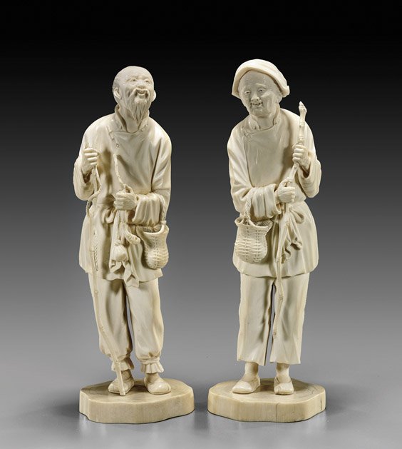 Pair Chinese Carved Man and Woman: Pair Chinese Carved Man and Woman Pair early 20th Century, finely patinated and well-carved Chinese ivory old man and woman: both standing and carrying a staff and basket, he with a pipe (tops of both