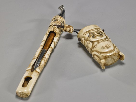Antique Japanese Bone/Antler Pipe Case & Inro: Antique Japanese Bone/Antler Pipe Case & Inro Antique Japanese carved bone or antler figural pipe case: in the form of a standing figure in long robes and cap (repaired), with pipe; and with matching 