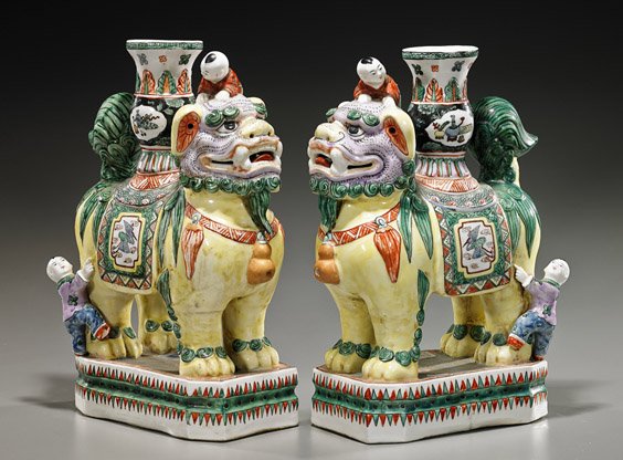 Pair Chinese Famille Verte Lion Vessels: Pair Chinese Famille Verte Lion Vessels Pair Chinese Famille Verte porcelain lion vessels; each with a lion standing atop a rectangular plinth: with a vase on the back of each and each with two boys c