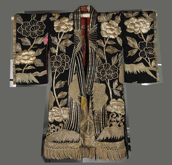 Antique Japanese Embroidered Velvet Robe: Antique Japanese Embroidered Velvet Robe Antique Japanese embroidered velvet robe; heavily embroidered in gilt metallic thread with Shi-shi and flowers design on black ground, lined with colorful text