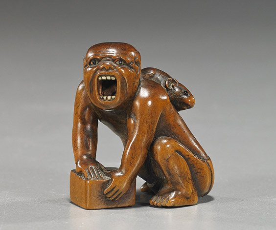Antique Carved Wood Netsuke: Rat Catcher: Antique Carved Wood Netsuke: Rat Catcher Antique carved wood netsuke; of a rat catcher, trying to catch a rat beneath a box, but the rat climbing on the man's back, inlaid eyes and teeth, 19th Century