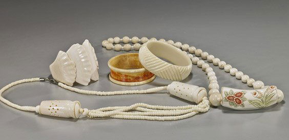 Group of Various Carved Ivory Jewelry: Group of Various Carved Ivory JewelryGroup of various ivory jewelry, including: lotus petal bracelet; brown bangle bracelet (small hole); plastic triangle ribbed bangle bracelet; round bead necklace w