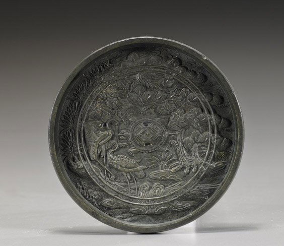 Small Antique Japanese Bronze Mirror: Small Antique Japanese Bronze MirrorAntique Japanese bronze mirror; circular with crane and turtle near the shore with pine all around (minor wear), late 19th Century; D: 4 1/2"