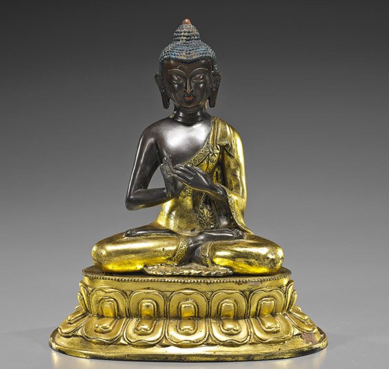 Sino Tibetan Parcel-Gilt Bronze Deity: Sino Tibetan Parcel-Gilt Bronze Deity Sino Tibetan parcel-gilt bronze Buddhist deity; seated in lotus posture atop a separate lotus base and with hands in mudra, good detailing, some pigments remainin