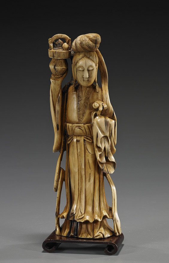 Antique Chinese Carved Ivory Standing Beauty: Antique Chinese Carved Ivory Standing BeautyAntique Chinese carved ivory (probably fossil mammoth) figure of a beauty; standing in long robes, holding aloft a basket with peaches in one hand, a sectio