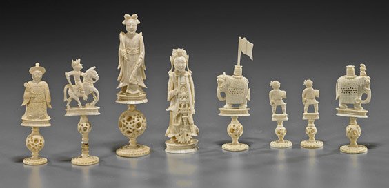 Group of 8 Antique Chinese Ivory Chess Pieces: Group of 8 Antique Chinese Ivory Chess PiecesGroup of 8 antique Chinese carved ivory chess pieces: two large figures (king and queen), together with various other figures and elephants, some with puzz
