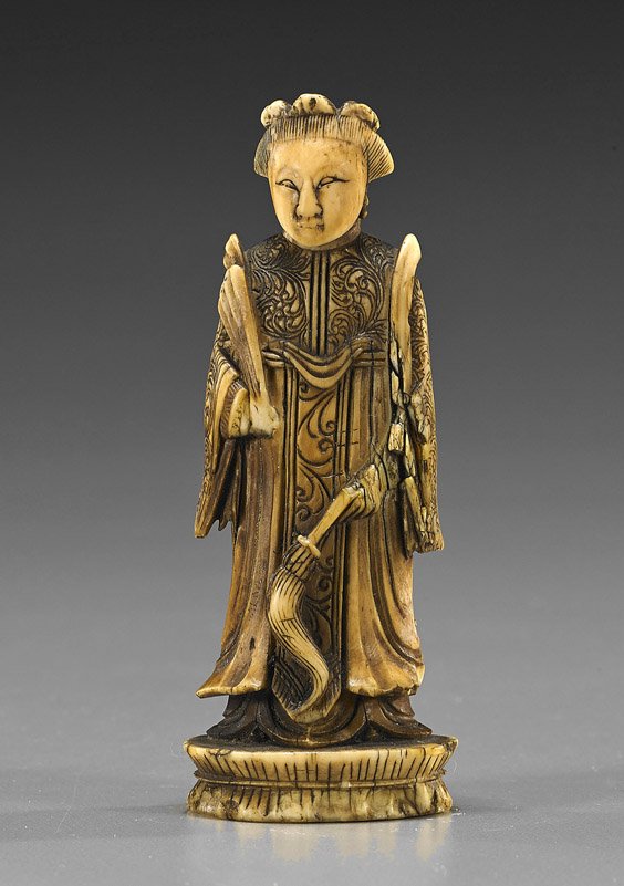 Antique Chinese Carved Ivory Chess Pieces: Antique Chinese Carved Ivory Chess PiecesAntique Chinese carved and ivory chess piece (queen); standing in long robes and carrying a whisk in one hand, a fan in the other, with fine patina and good de