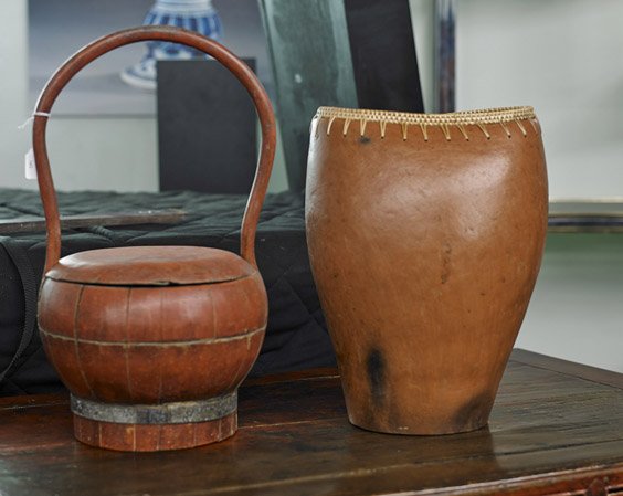 Two Various Asian Containers: Two Various Asian Containers Two various Asian containers: Indonesian pottery vase with circular base and oval rim, basketry top; together with antique Chinese lacquered wood basket with tall loop han