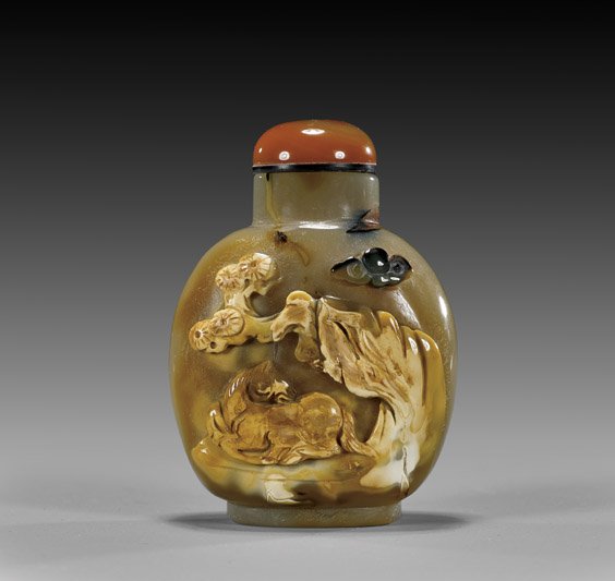 CAMEO CARVED AGATE SNUFF BOTTLE: CAMEO CARVED AGATE SNUFF BOTTLE Finely hollowed, carved cameo agate snuff bottle; of rounded form: the front with design of horse resting beneath rockery and pine tree in relief rendered from the opaq