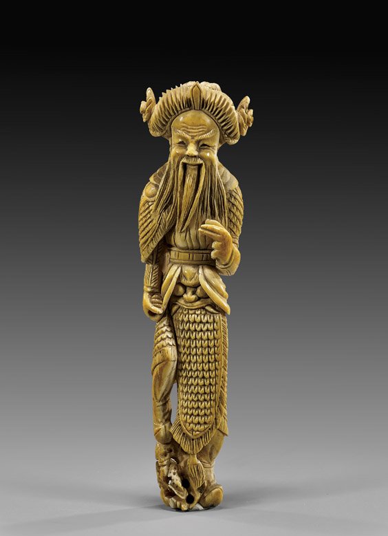 ANTIQUE CHINESE CARVED IVORY WARRIOR: ANTIQUE CHINESE CARVED IVORY WARRIOR Finely carved and patinated, antique Chinese ivory figure; of a bearded warrior Immortal in detailed armor, with one foot on openwork rockery; probably 18th Centur
