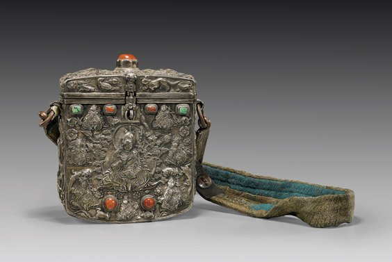 ANTIQUE SINO-TIBETAN SILVER SUTRA CASE: ANTIQUE SINO-TIBETAN SILVER SUTRA CASE Antique Sino-Tibetan repoussé silver traveling/sutra case; each side with design centering a seated Buddhist deity surrounded by other smaller deities and anima