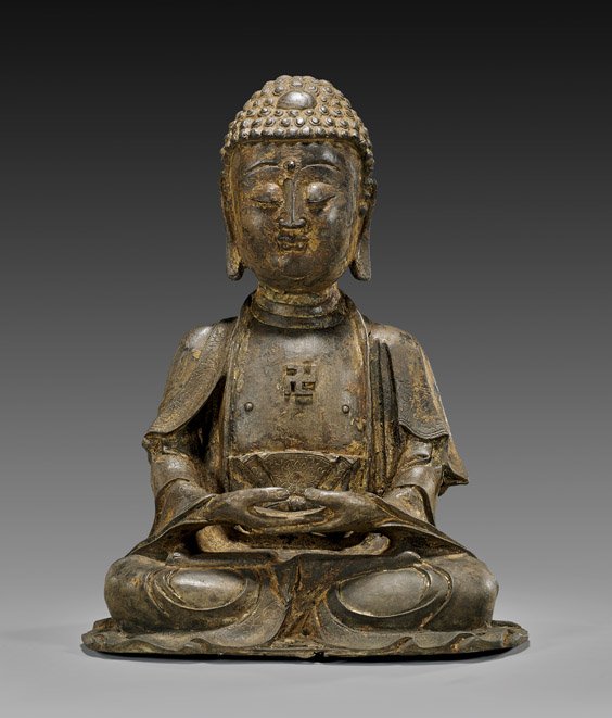 HEAVY MING-STYLE BRONZE SEATED BUDDHA: HEAVY MING-STYLE BRONZE SEATED BUDDHA Heavy Chinese Ming-style bronze seated Buddha; with hands together in meditation (dhyana) mudra, with Buddhist symbol on his chest; with some traces of gilt lacqu