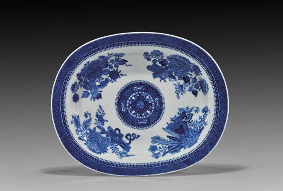 QIANLONG EXPORT BLUE & WHITE PLATTER: QIANLONG EXPORT BLUE & WHITE PLATTER 18th Century Chinese Qianlong Period, blue and white Export porcelain oval platter; with a quadrant design of flowers and Buddhist objects, centering a pomegranate