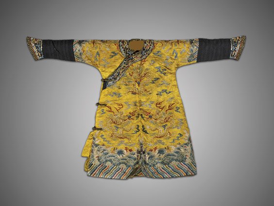 CHINESE SILK DRAGON CHILD'S ROBE: CHINESE SILK DRAGON CHILD'S ROBERare Chinese Imperial-style yellow ground silk child's robe; with five-clawed dragons in gilt metallic thread amid clouds and flaming pearls, all above a typical lishui