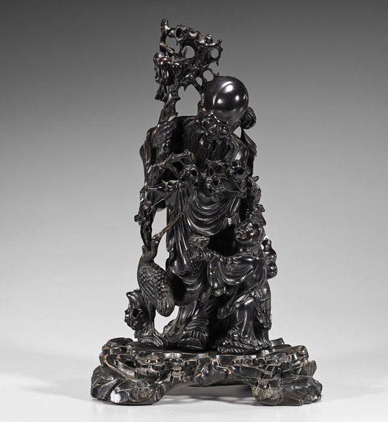 Old Chinese Carved Hardwood Shoulao: Old Chinese Carved Hardwood Shoulao Very elaborate and old, Chinese carved hardwood Shoulao; standing in long robes and holding a staff with the "Three Fruits of Abundance", with attendant and crane a