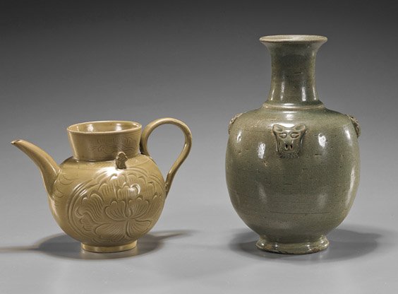 Two Chinese Early-Style Celadon Vessels: Two Chinese Early-Style Celadon VesselsTwo Chinese Early-style, celadon glazed vessels: Jin-style, Yueh-type bottle vase with 3 molded masks at the shoulder; together with a Song-style yaozhou teapot