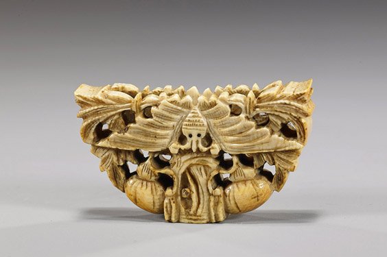Antique Chinese Carved Ivory Fan Holder: Antique Chinese Carved Ivory Fan Holder Antique Chinese, openwork carved ivory fan holder; with design of a moth with foliage and double gourds, inlaid eyes, 19th Century or earlier; L: 2"