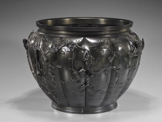 Antique Japanese Bronze Lobed Jardinière: Antique Japanese Bronze Lobed JardinièreAntique Japanese bronze jardinière; of lobed form with birds and flowering branches in high relief; the interior bottom cast mirror-like with cranes and chara