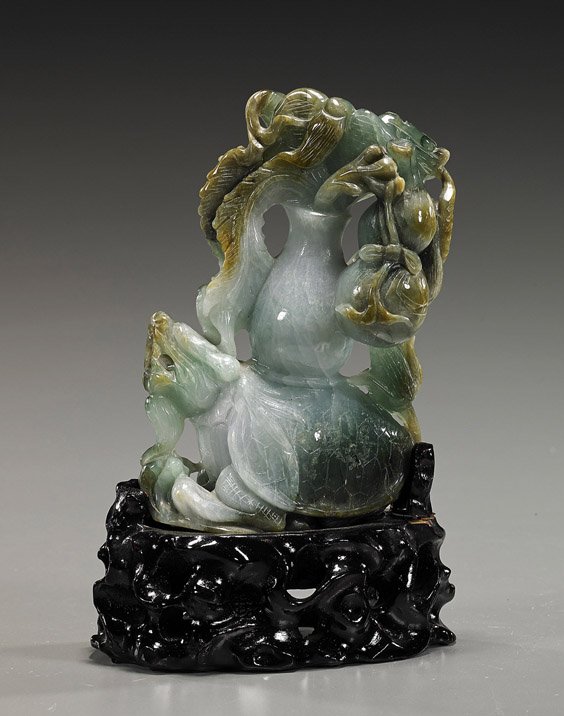 Chinese Carved Jadeite Dragon-Turtle Group: Chinese Carved Jadeite Dragon-Turtle Group Chinese carved jadeite model of a dragon turtle; with a large vase on its back, holding various Buddhist items: including a whisk, dragon staff, double gourd