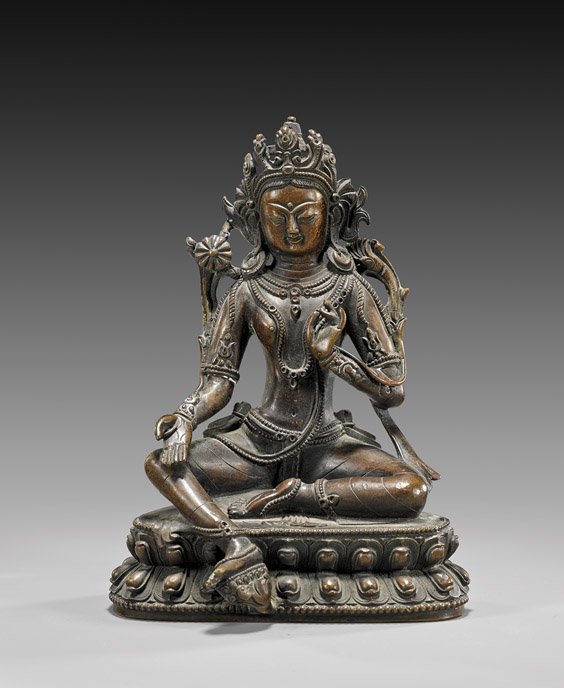 SINO-TIBETAN BRONZE BUDDHIST DEITY: SINO-TIBETAN BRONZE BUDDHIST DEITY Well cast, Sino-Tibetan coppery-bronze figure; of the Buddhist deity Tara: seated in the position of "Royal Ease"; elaborately ornamented with well detailed crown an