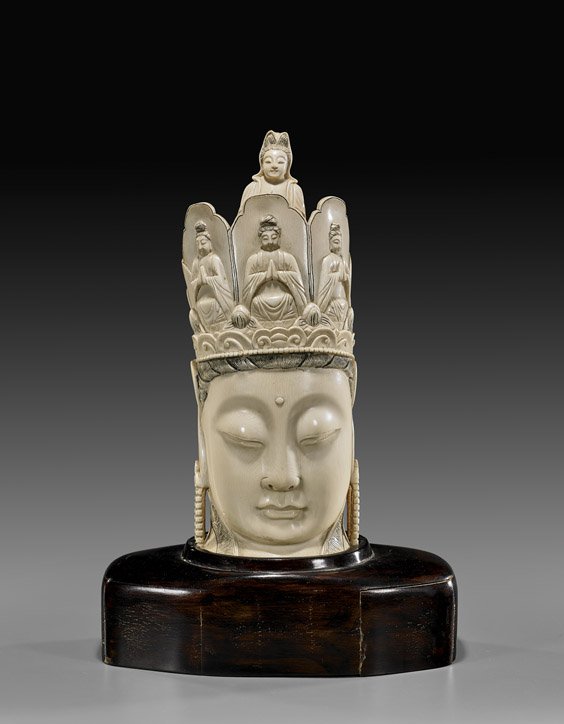 CHINESE IVORY & WOOD GUANYIN BUST: CHINESE IVORY & WOOD GUANYIN BUST Well carved and finely polished, early 20th Century Chinese ivory head of Guanyin: her crown with three Buddhist deities to the front and Budai to the verso; a prayin