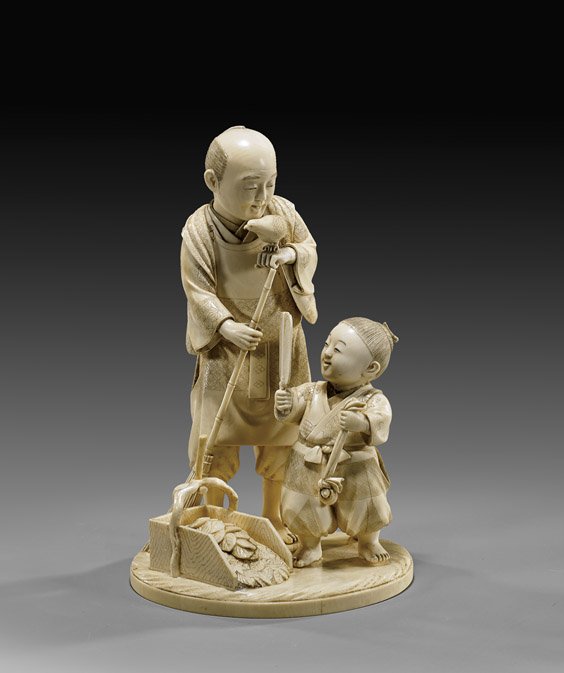 ANTIQUE CARVED IVORY FIGURAL OKIMONO: ANTIQUE CARVED IVORY FIGURAL OKIMONOFinely carved, antique Japanese sectional ivory okimono group; of a man with broom sweeping leaves: a bird perched on his hand, with a child beside him holding a fa