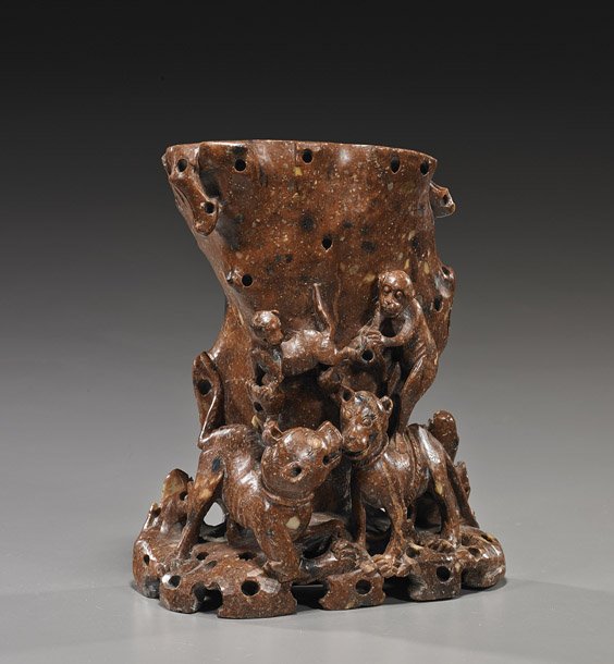 Old Chinese Carved Soapstone Vase: Monkeys: Old Chinese Carved Soapstone Vase: Monkeys Old Chinese carved soapstone vase; of naturalistic form with high relief and openwork design of monkeys standing atop two dogs, early 20th Century; H: 8 1/2"