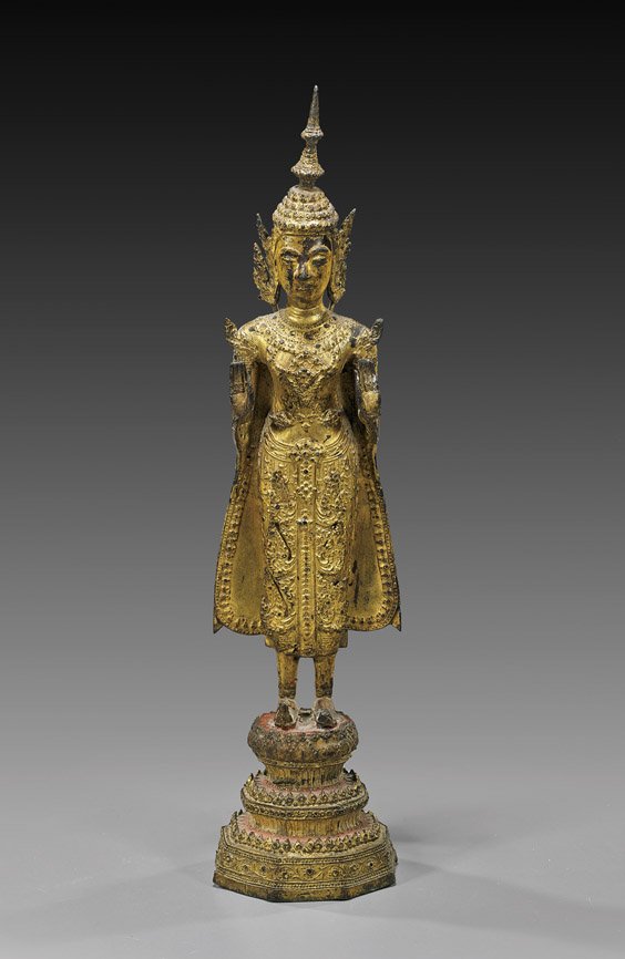 Antique Thai Gilt Bronze Standing Figure: Antique Thai Gilt Bronze Standing Figure Antique Thai gilt bronze figure; standing on a stepped base, wearing elaborate robes and tall headdress, and with hands in mudra (usual wear); H: 14 1/2"