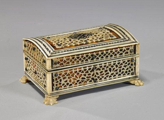 Antique Carved Bone & Shell Box: Antique Carved Bone BoxAntique box; rectangular form on claw feet with sectional openwork carved bone paneling over tortoise shell, veneer (wear and some flaws), Circa 1900; L: 3 1/2"