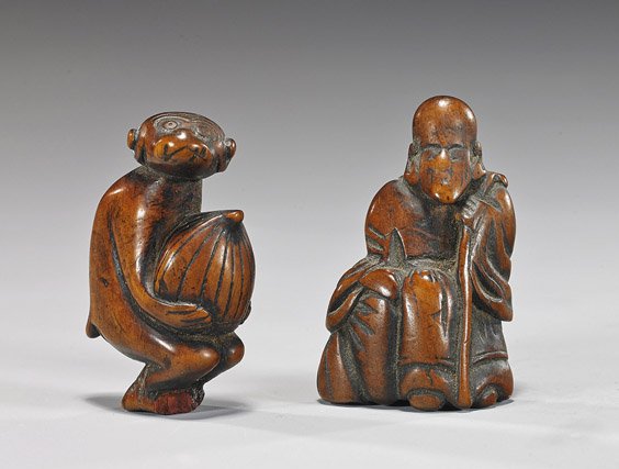 Two Antique Carved Wood Netsuke: Two Antique Carved Wood Netsuke Two antique and well patinated, carved wood netsuke: crouching monkey carrying a large peach or hazelnut; and seated bearded sage with staff (some wear to each), both e