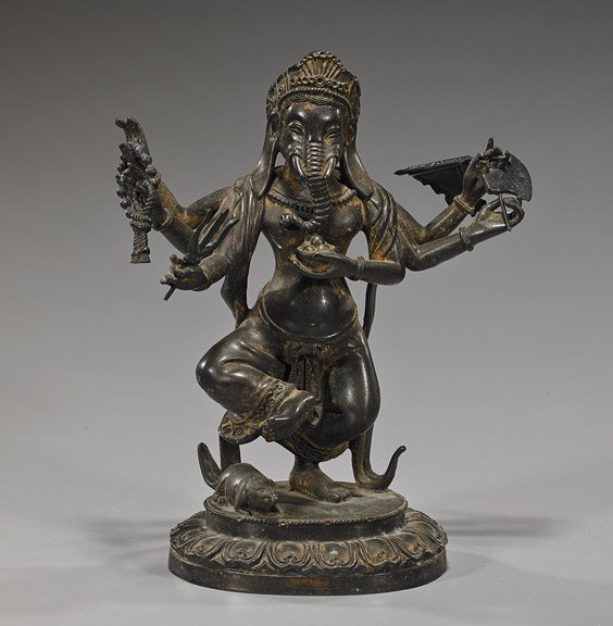 Old Indian or Nepalese Bronze Standing Ganesha: Old Indian or Nepalese Bronze Standing Ganesha Old Indian or Nepalese bronze figure of a six-armed Ganesha; standing on one foot atop a stylized lotus base, a rat at his feet and holding various loose