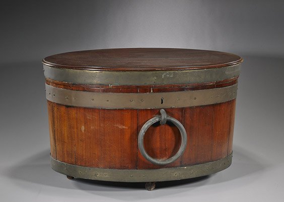 Antique English Large Oval Wood Cellaret: Antique English Large Oval Wood CellaretAntique English, probably George III, brass mounted large oval wood cellaret; tub-form on feet and with a single large loose ring to the front, hinged cover wit
