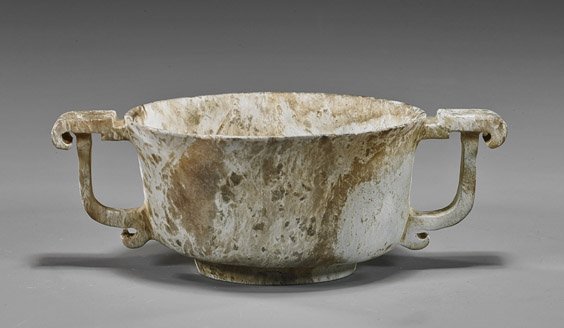 Chinese Ming-Style Jade Gui-Form Vessel: Chinese Ming-Style Jade Gui-Form Vessel Unusual Chinese, Ming-style "chicken bone"-type jade vessel; gui-form with two handles, possibly antique (heavily "calcified"); L: 6"