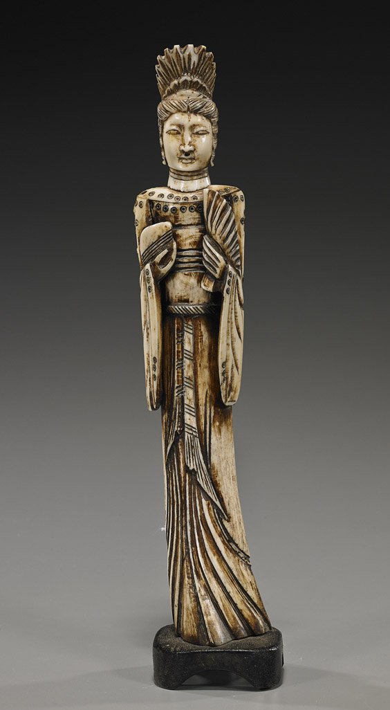 Antique Japanese Carved Bone Beauty: Antique Japanese Carved Bone BeautyAntique Japanese carved bone beauty; standing in long robes and wearing a crown, carrying a fan in one hand, a peach in the other, Circa 1900; H: 10 1/2", wood stand